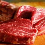 beef pieces on a wooden table